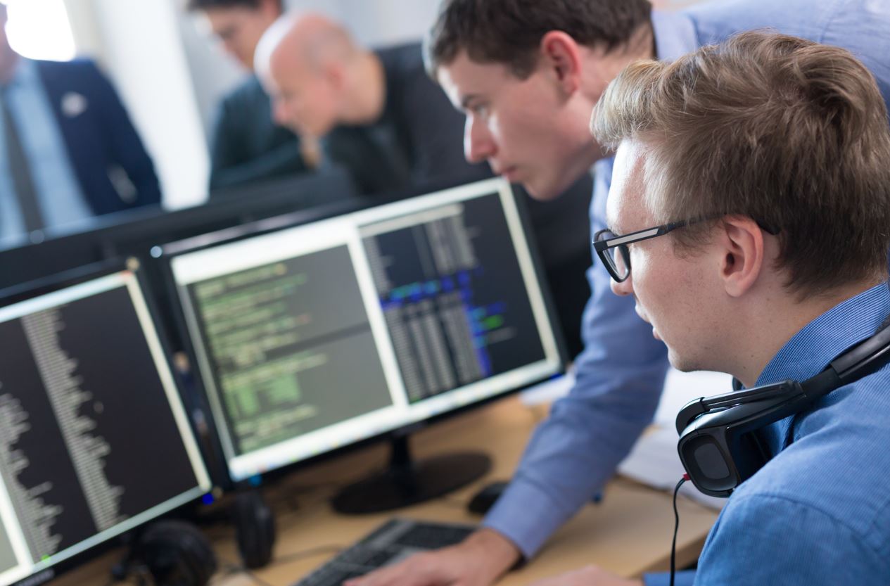 Two men working on a computer