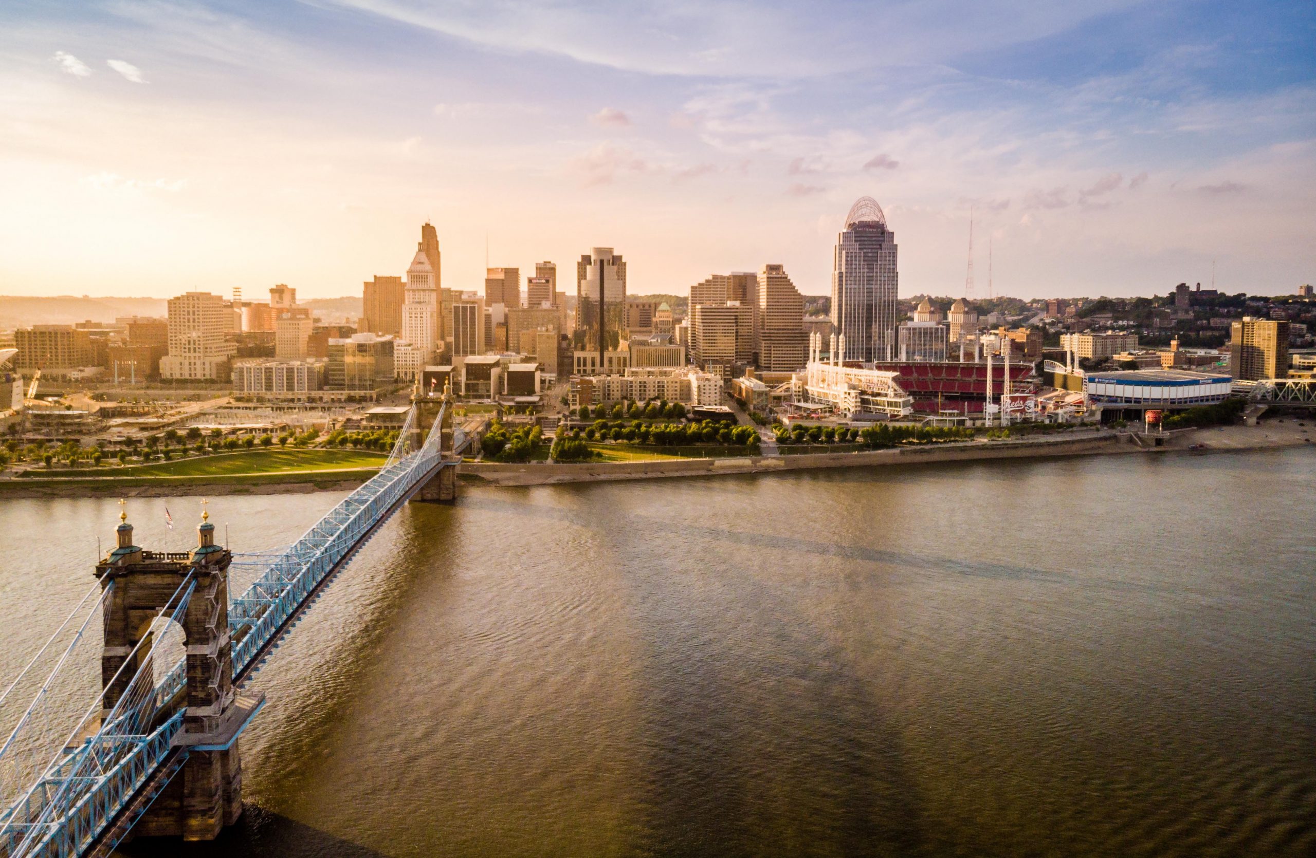 Skyline Image of Downtown Cincinnati with Ohio River and John A. Roebling Bridge