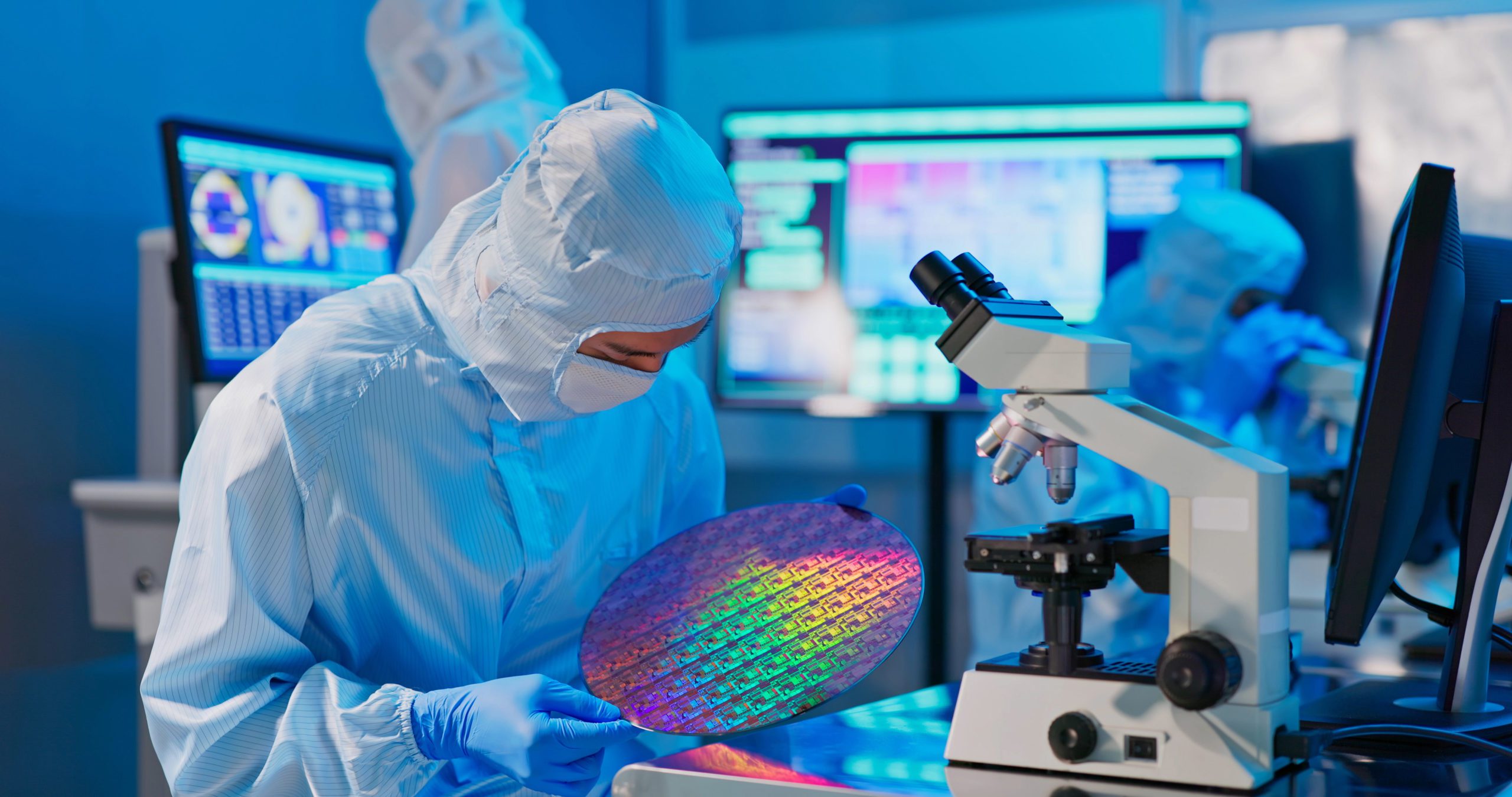Technician with a semiconductor wafer