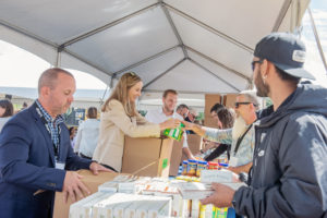 Divert employees working a donation tent picture.